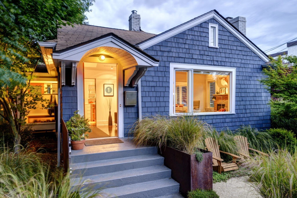 Seattle, Washington, USA,USA,Illuminated front stoop and of blue house - Joshua J. Phillips Construction Seattle, Washington, USA,USA,Illuminated front stoop and of blue house